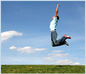 Clear field with man jumping